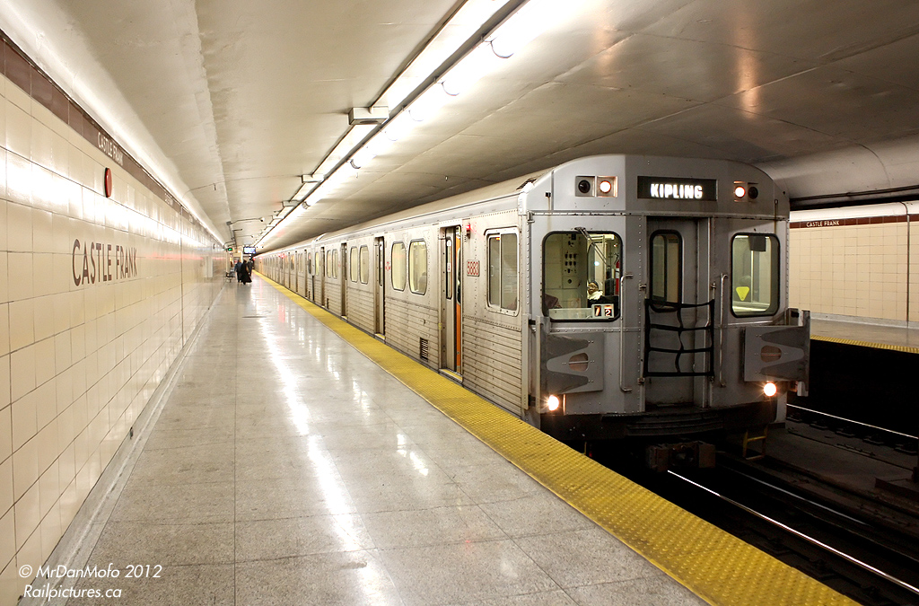 After leaving busy St. George and Yonge transfer stations, a train of H6 subway cars lead by 5883 pauses at Castle Frank before crossing the Prince Edward Viaduct into East York, on the other side of the Don Valley. The photographer won't be making the trip into Scarborough today, and hops off for a quick photo op before heading back downtown. While the H6's are still operating in regular service, future Toronto Rocket deliveries are scheduled to displace the entire ~126 car fleet.