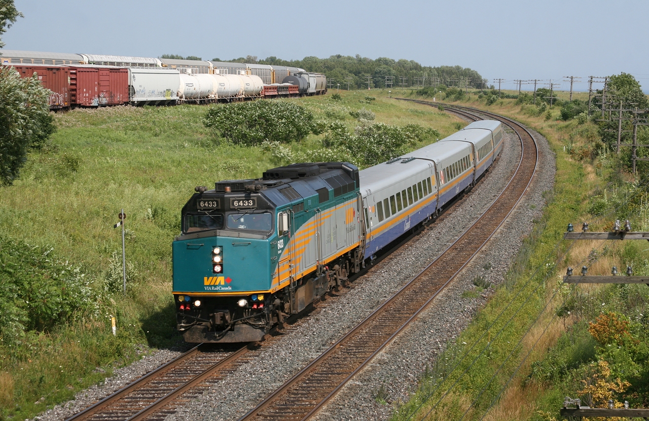 After having overtaken CN 369 at Newtonville, VIA 61 flies through Newcastle as CP 234 and CP 235 meet at Lovekin.