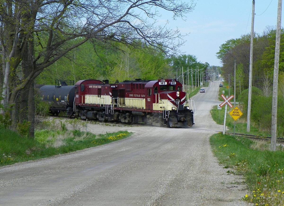 OSR struggling to warm the journals as she shoves numerous empties back, uphill and around a curve, into the Cami Plant.