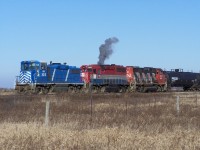 The SOR crew at Garnet has come to duty and is preparing to start work on a cold December morning.  RLK 4057 is seen letting off a huge belch of smoke as it is fired up after sitting for several hours.  Almost looks like an ALCO.