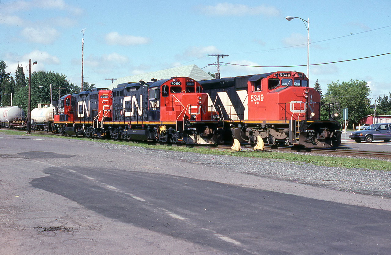 CN 310 rolls past the 514,s engines resting for the week end.