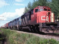 CN 391 approaching the curve 1 mile east of the town with 2 loaned GM used SDs.