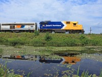 Ontario Northland 1809 makes a pretty reflection in a pond just south of Martins, 2012-07-15