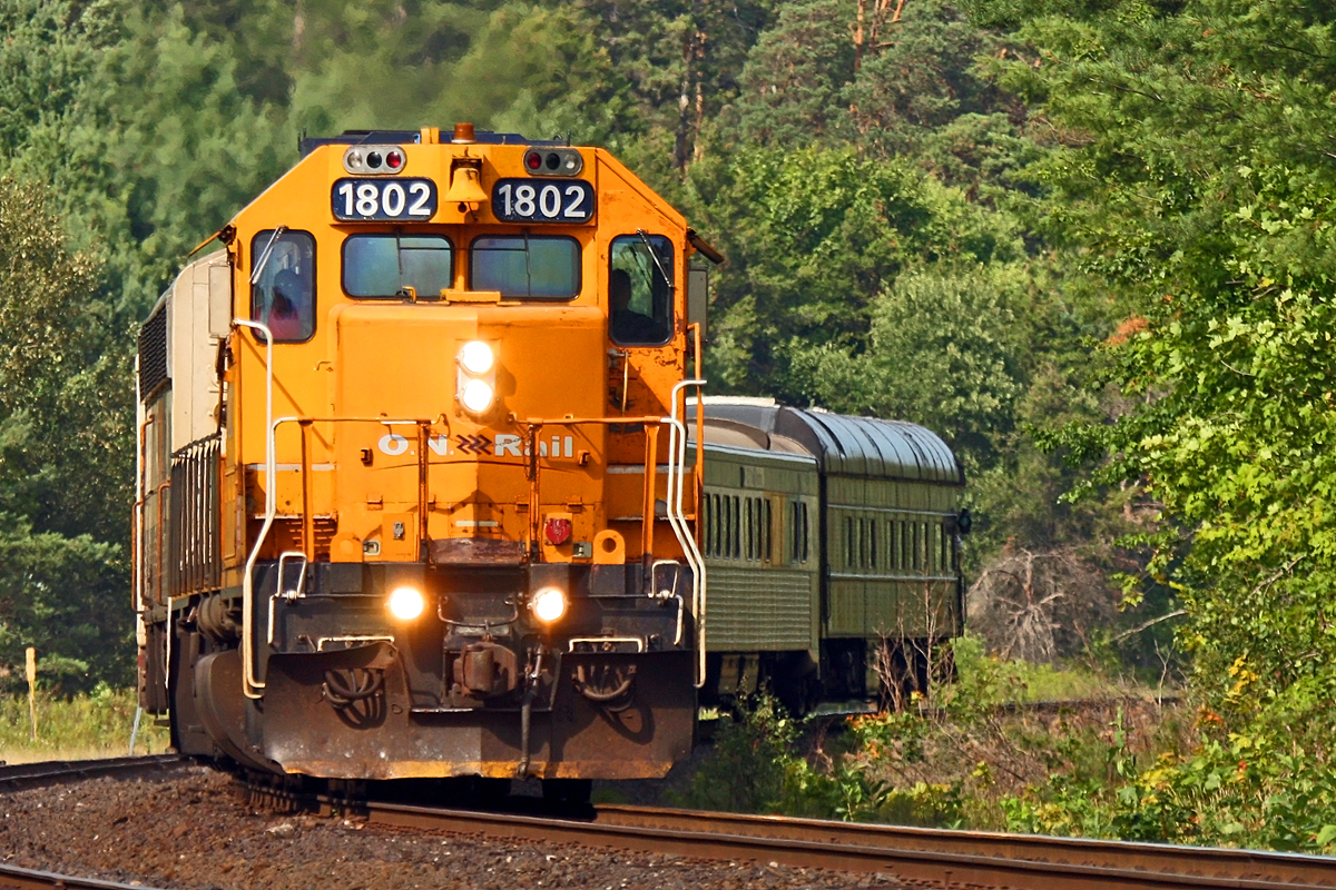 ONR 1802 leads 698 south through Martins with the Mother Parker's "Pacific" observation car in tow.