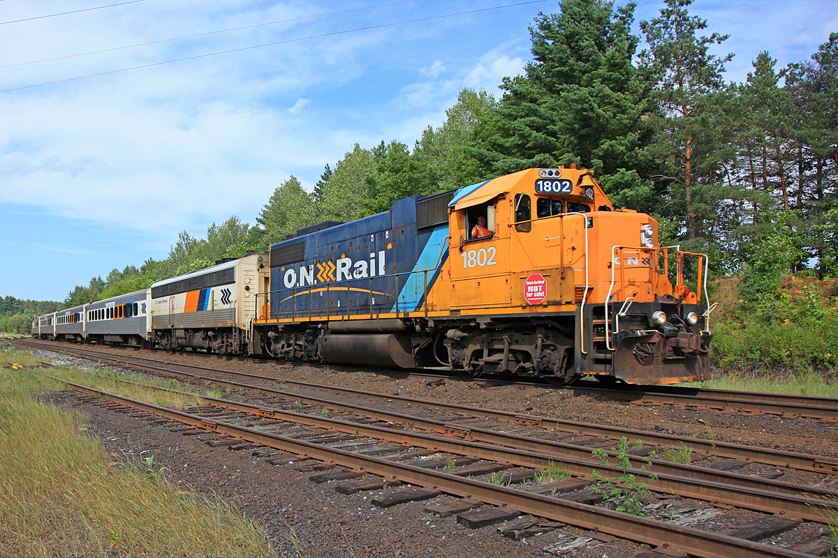 ONR 1802 leads 698 south through Martins with the Mother Parker’s “Pacific” observation car in tow, although it is hardly evident in this view as it it partway around the bend.