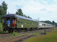 Michael and Paul Higgins Jr. enjoy the view from their family's private car, the Mother Parker's "Pacific" as they wave at railfans all down the line. The car was tacked on to the end of Tuesday's northbound Northlander from Troronto to Cochrane, hitched a ride on the Polar Bear Express to Moosonee and back on Wednesday and today is returning to Toronto on 698, the southbound Northlander.
