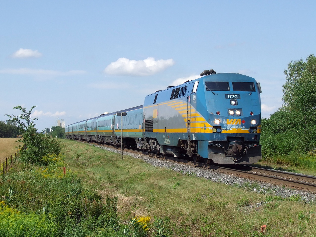 VIA 25 hits the crossing at c 80 MPH,10 minutes to Drummond station.