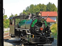 Taking a spin on the little homemade turntable at the west end of the line with the Rotary Village Station in the background, as seeen from inside the train shed. The turntable is constructed with the rails mounted on a thick steel plate bolted to the swing bearing off an old Cat excavator which in turn is mounted on a 6-foot deep concrete base.