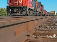 A pair of GP's sit on the south track between Tansley and Ash awaiting the arrival of CN 399, today's train consists of 5 empty scrap gons for Triple Metals and 2 loads of lumber for Tamarack Lumber. 