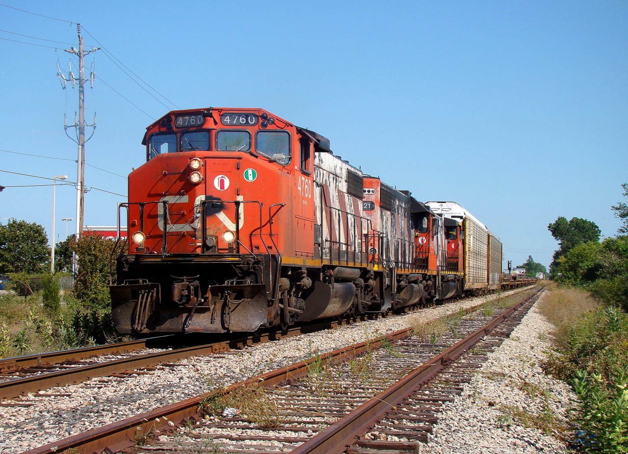 Two GP38-2W's and a GP38-2 lead a 30 car 439 along the CASO just a few minutes before terminating at Van de Water yard in Windsor.