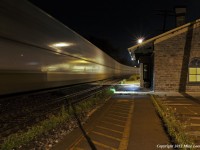 Slithering through the night, CN 120 slips past the 1850's era Grand Trunk station in Port Hope, Ontario. 0124hrs.