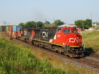 384 with CN 2197 - CN 5745 back under way after repairing a broken knuckle at Brantford