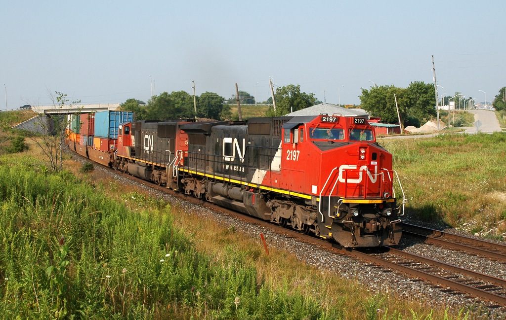 384 with CN 2197 - CN 5745 back under way after repairing a broken knuckle at Brantford