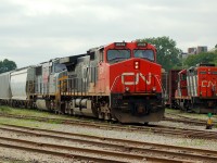 394 does some work in the yard behind CN  2574 - TFM 1607