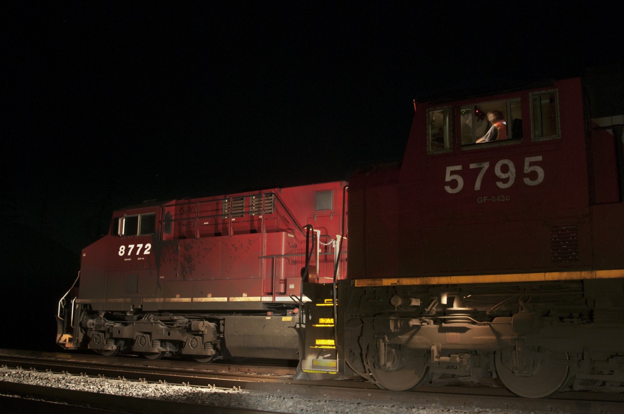 "In the Heat of the Night,"  CN 5795 crawls past a yarded CP westbound on a warn July evening.  This shot was the end of a good in "the Canyons."