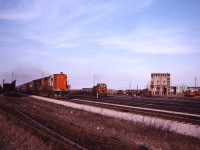 CN 3153 leads VIA Train 77 by the CN yard at Mimico with a Tempo trainset
