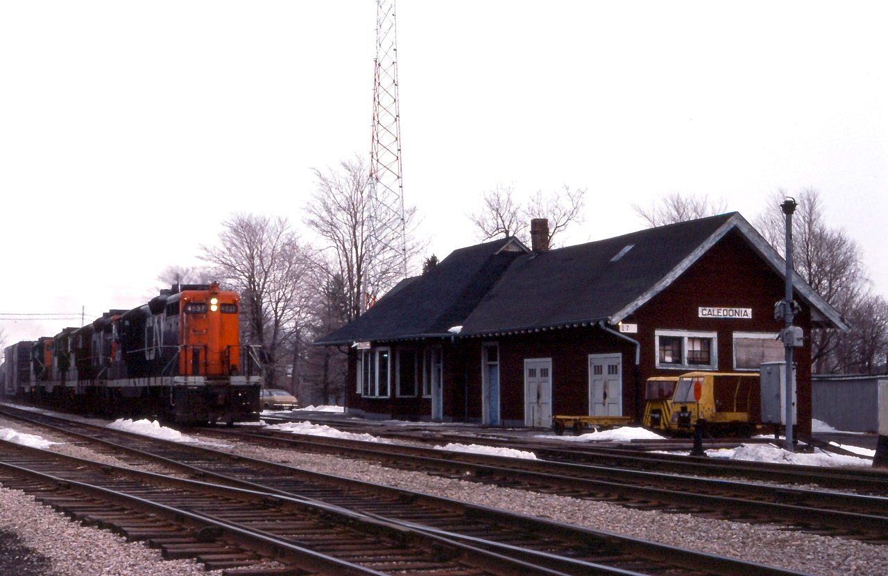 CN 387 rolls past the station at Caledonia