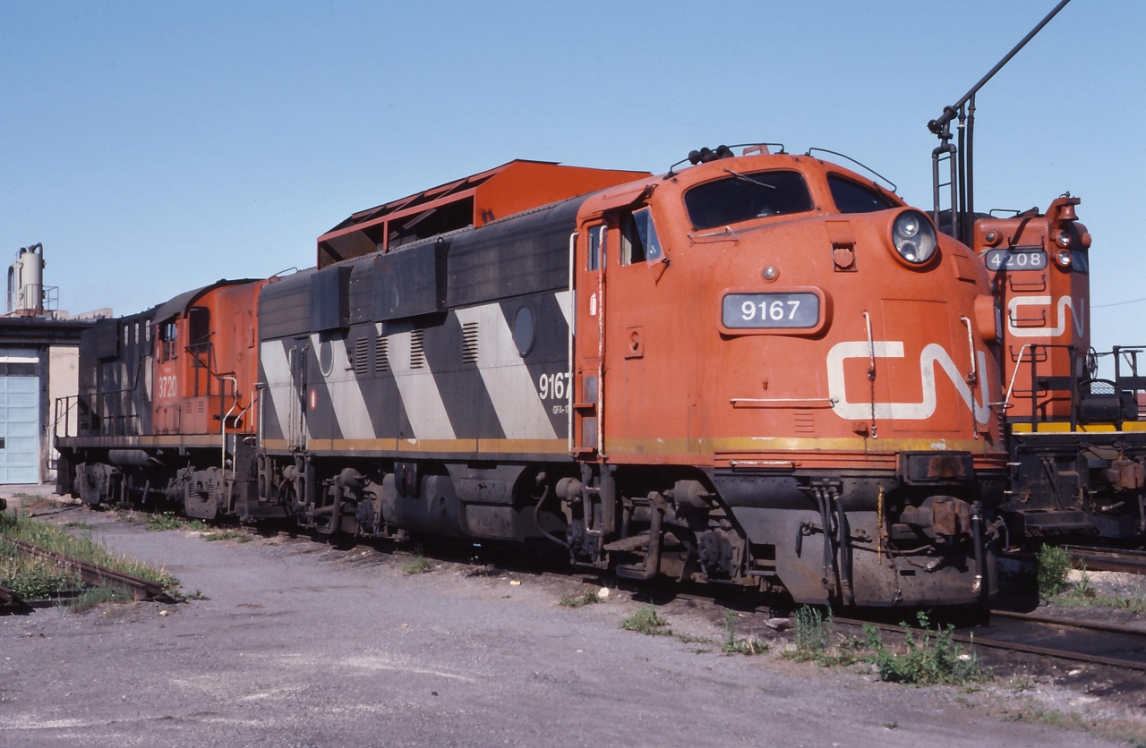 CN 9167 modified for plow service sits with CN 3720 at the shops in Belleville