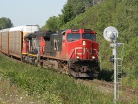 A CN 39x train heads south on the Halton Sub at a pretty good speed, just about to split the signals on the approach to 10th Sideroad.