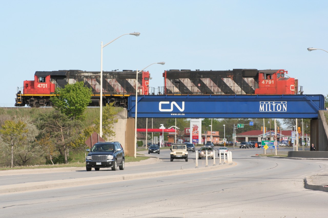 Two veteran CN GP units pause over Highway 25 in Milton.