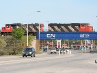 Two veteran CN GP units pause over Highway 25 in Milton.
