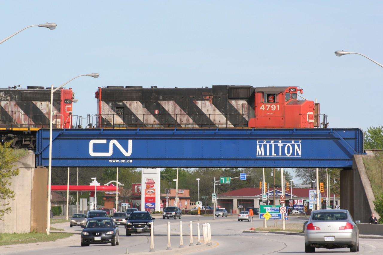 A CN 500-series local pauses over Highway 25 in Milton on a beautiful spring afternoon.