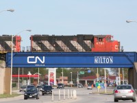 A CN 500-series local pauses over Highway 25 in Milton on a beautiful spring afternoon.