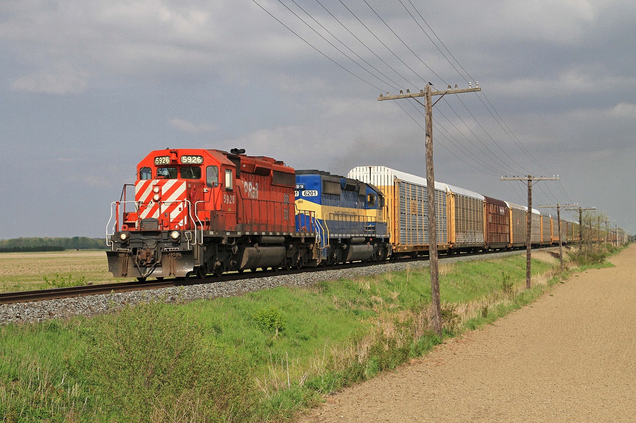 CP 5926 and DME 6201 lead westbound train 147-05 at mile 83.64 on the CP's Windsor Sub May 5, 2012.