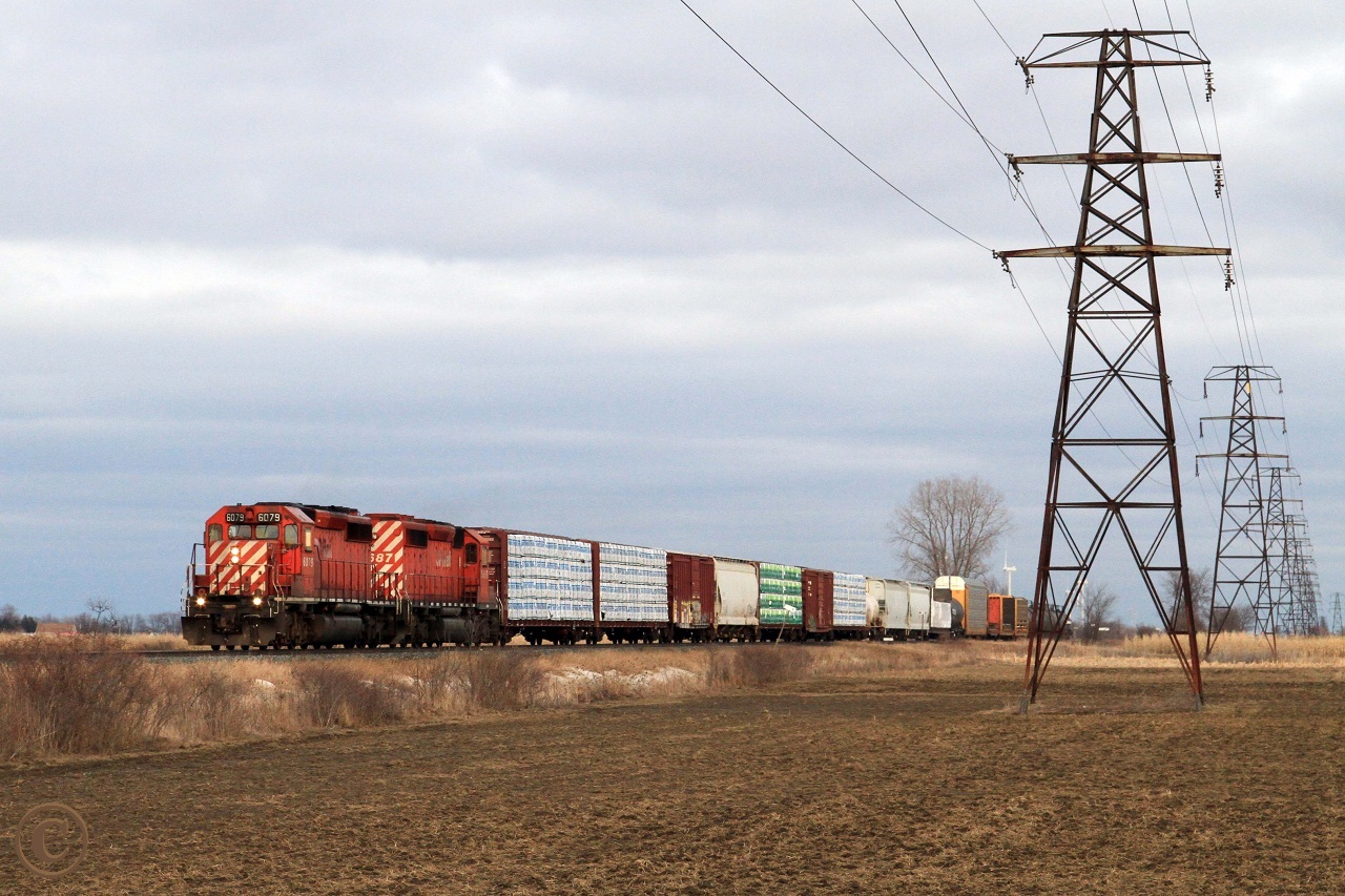 CP 6079 and 5687 power train 245 westward at mile 91.79 on the CP's Windsor Sub, Belle River Ontario February 19, 2012.