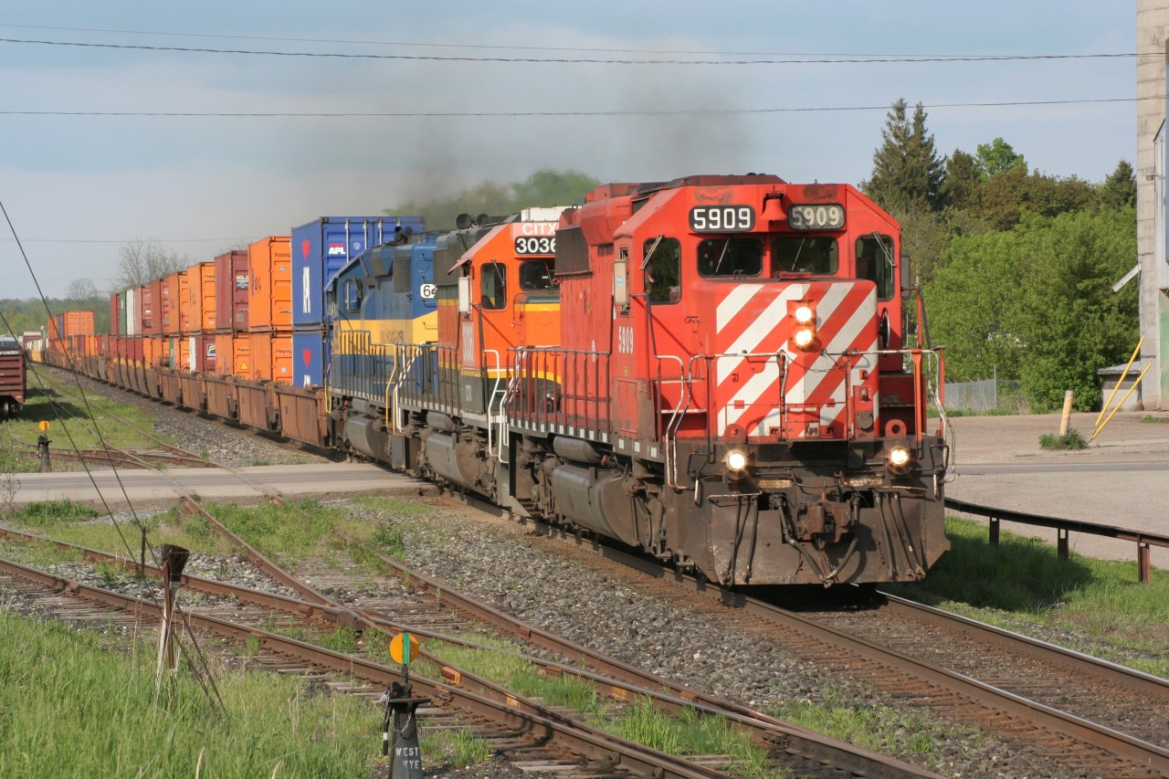 The first train I shot after being back in Ontario after a trip to Peru. It was nice to see this consist heading west. Here we see CP 5909 West storming past the feed mills and what is now a gym and storage units. Power is CP5909-CITX3036-ICE6422.