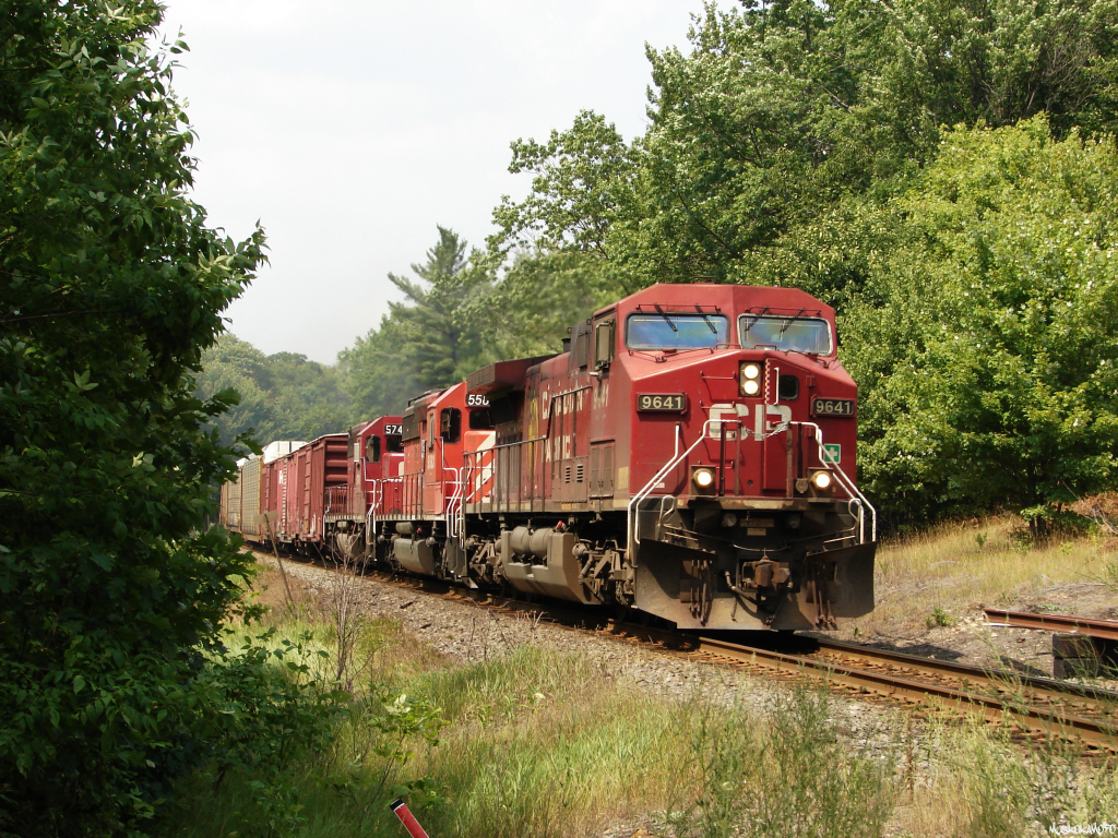 CP 9641 South with 420-01's freight of 79 cars highballs towards a crew change 4.7 miles down the line at MacTier.