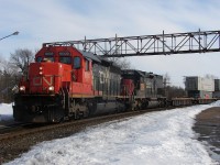 CN 103 - CN 6003 North rolls through Washago with a nice consist, after a tough winter we still had plenty of snow hanging around in late March of 2007...