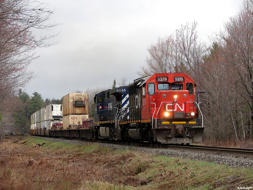 CN 104 - CN 5379 South making good time southbound down the Bala sub with stacks for Montreal in the spring of 2007.