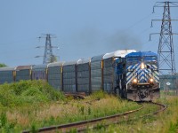 CP 141 led by sister units CEFX 1040 & 1041 rounds the bend into Tilbury on it's way to Belle River where it will go in the hole to wait for an eastbound.