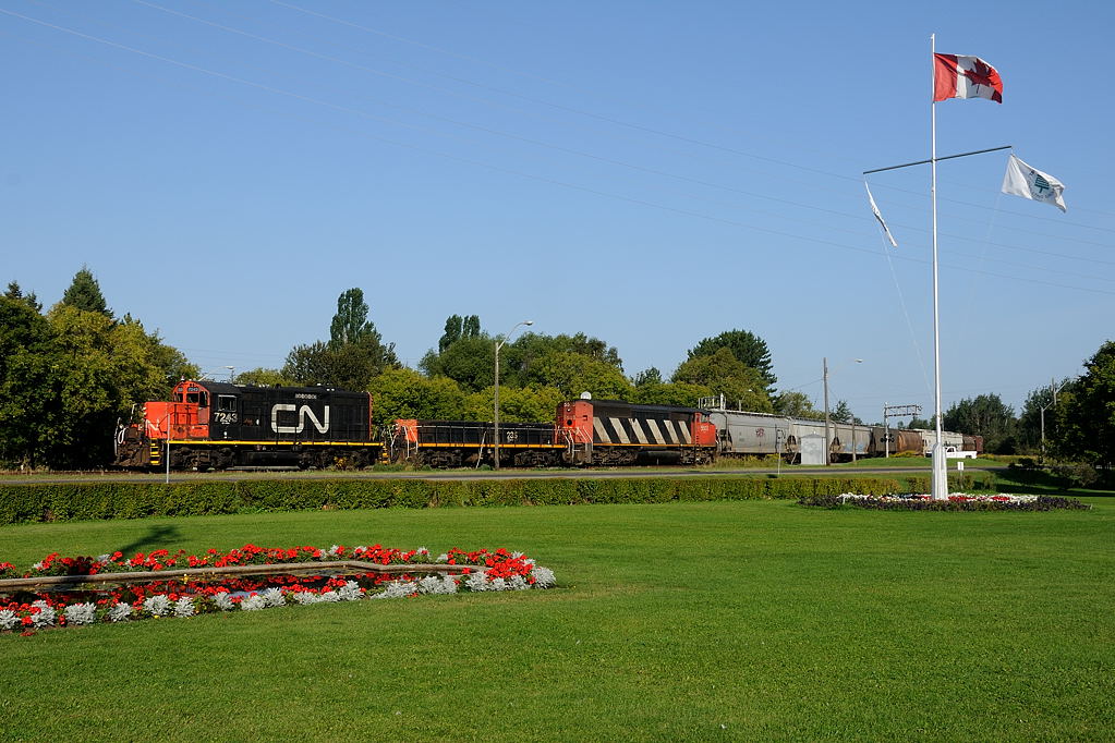 CN's 07:30 day job crosses James Street, enroute to servicing the "Mission industries". Today only 30 cars are in tow, mostly grain for the Mission and Cargill elevators plus a tank car for McAshphalt.