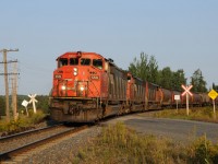 CN 84041-27 rolls through the small community of Kakabeka Falls, 20 minutes west of Thunder Bay with a trio of SD60F's CN 5551-CN 5554-CN 5532. Lash ups similiar to this have been common place on trains into the Lakehead during the summer of 2012.