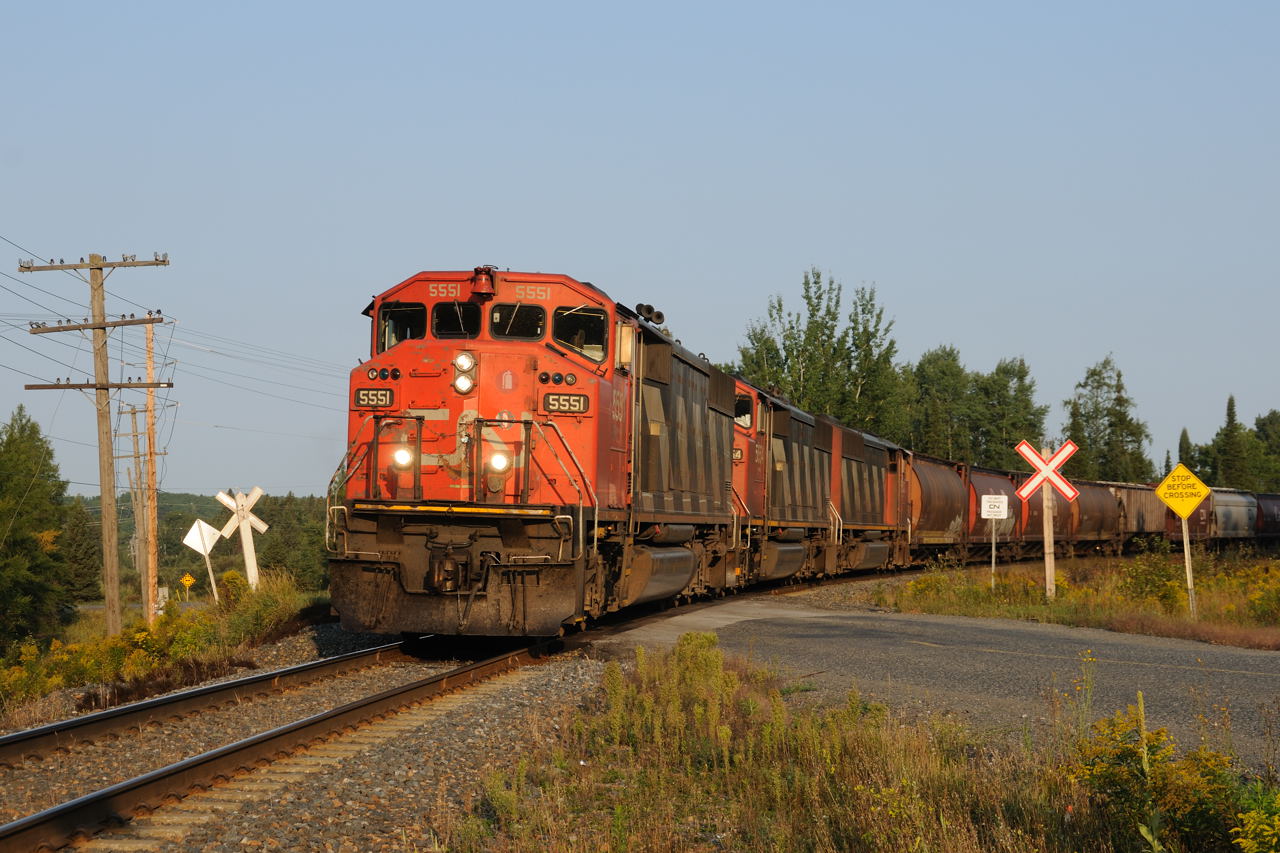CN 84041-27 rolls through the small community of Kakabeka Falls, 20 minutes west of Thunder Bay with a trio of SD60F's CN 5551-CN 5554-CN 5532. Lash ups similiar to this have been common place on trains into the Lakehead during the summer of 2012.