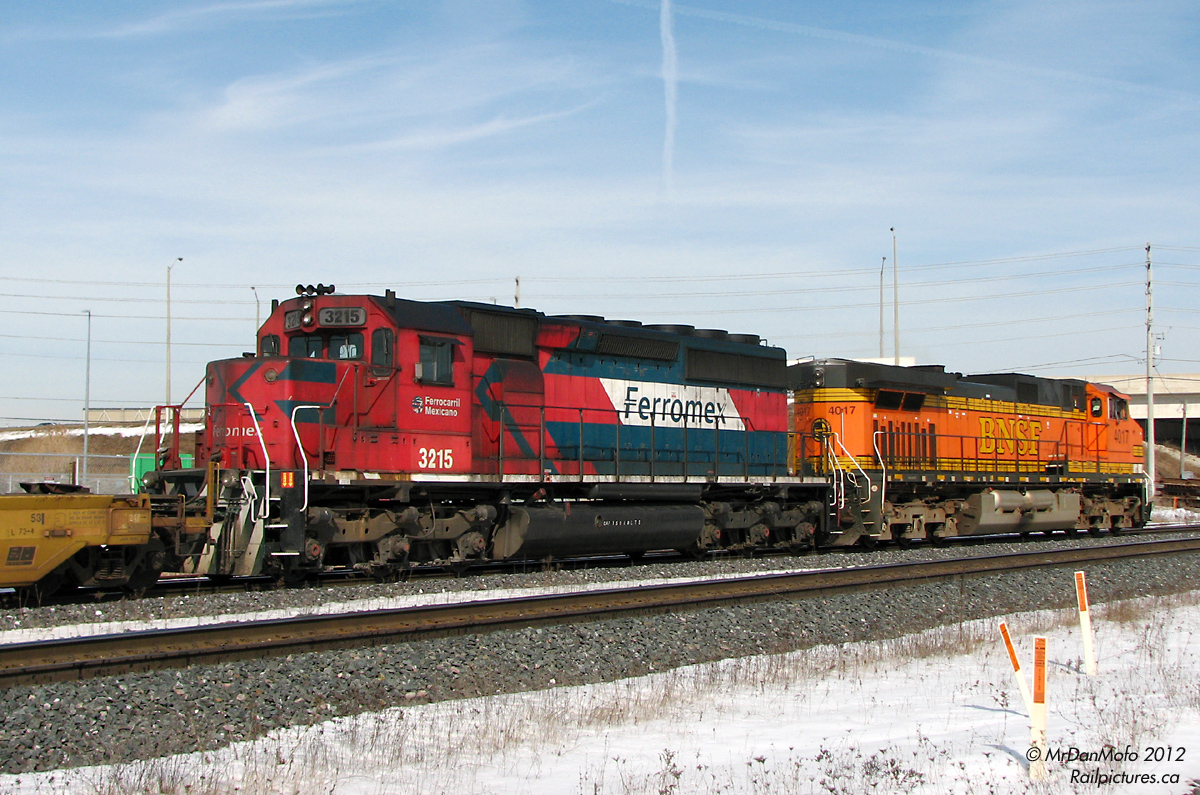 A Mexican visitor. Trailing on a detouring CN intermodal (#150), Foreign Power makes an appearance in the form of Ferromex SD40 3215 trailing BNSF Dash-9 4017, headed for Brampton Intermodal Terminal. One doesn't see Mexican power this far north too often.
