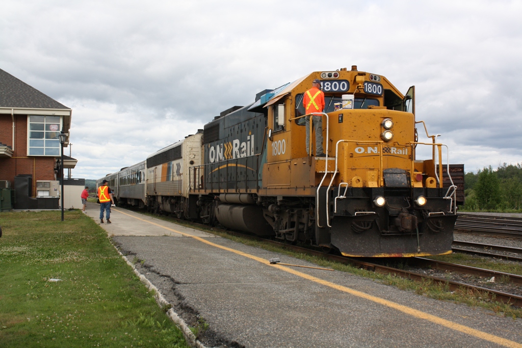 This picture is kind of an odd one...Here we see the Southbound Northlander stopped in front of the Englehart station.  About fifteen minutes before their arrival I heard the conductor call over on the scanner that they would be needing a person to clean off their windshield at Englehart.  No it was not for bugs.  They had hit a dead moose on the tracks and it had gotten moose guts onto the locomotive.  Not your everyday station stop!