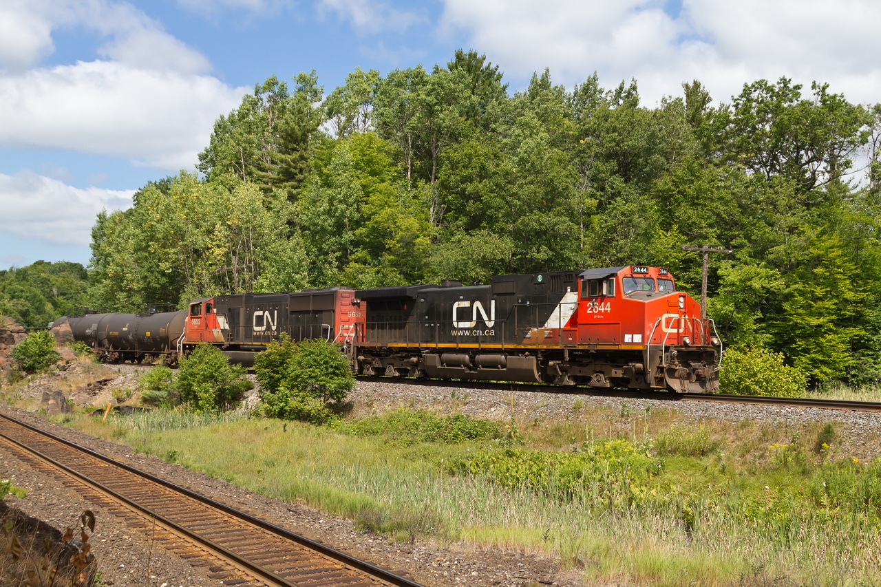 A southbound CN freight blasts through a rock cut at Rosseau Road just south of Parry Sound