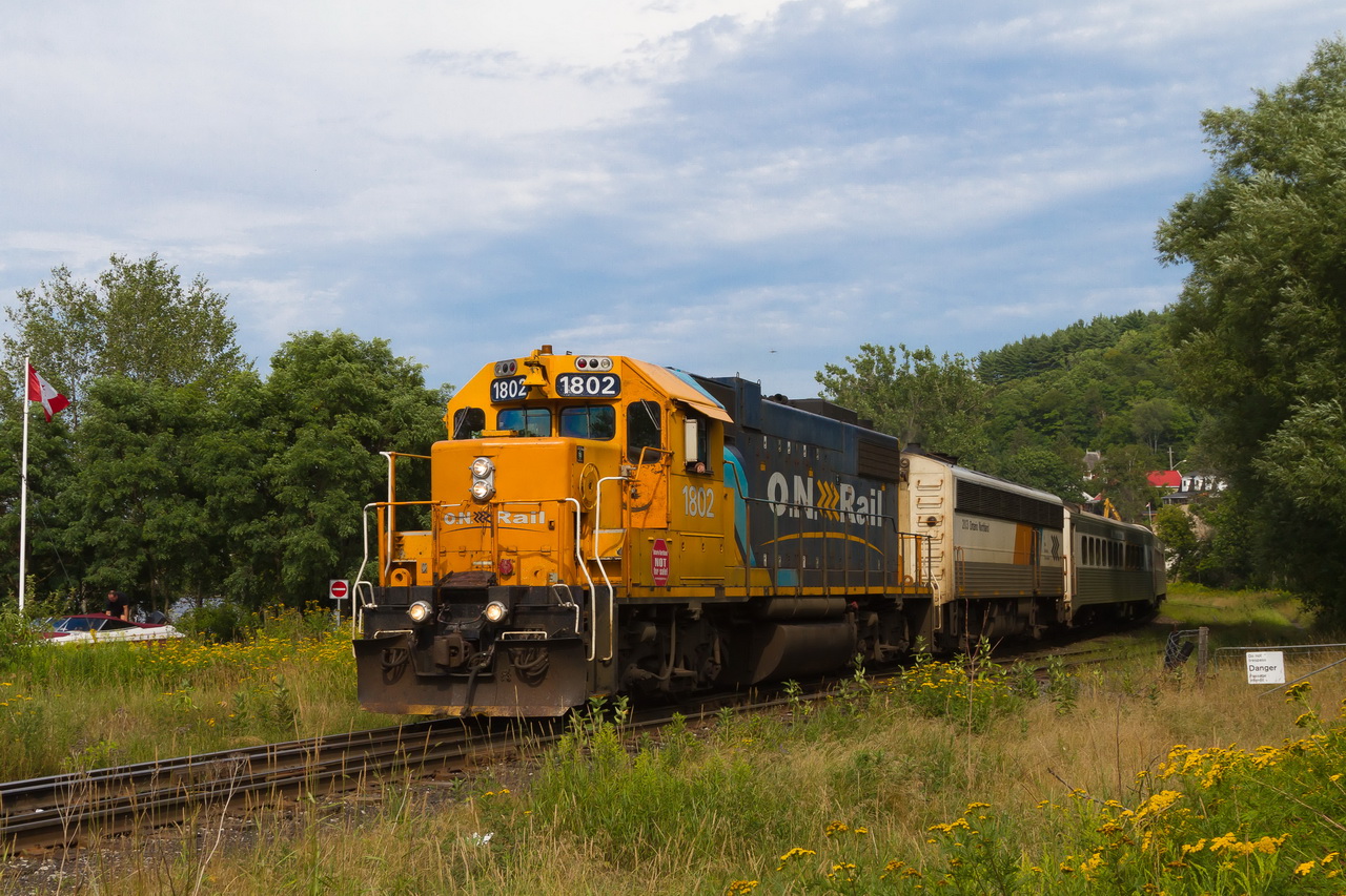 Southbound ONR train 698 is just departing Huntsville with private car PACIFIC in tow