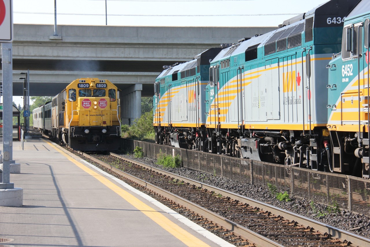 The northbound ONR train meets the southbound VIA Canadian at the Langstaff GO Station, Yonge Street and Highway 7, in Richmond Hill.