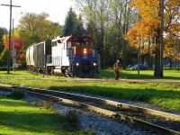 RLK (GP35) 2211 eb mixed arr Stratford ON off Goderich Sub.  Fall colours, 6pm, pauses as RA employee tends to 'opening the gate' - 133mm.