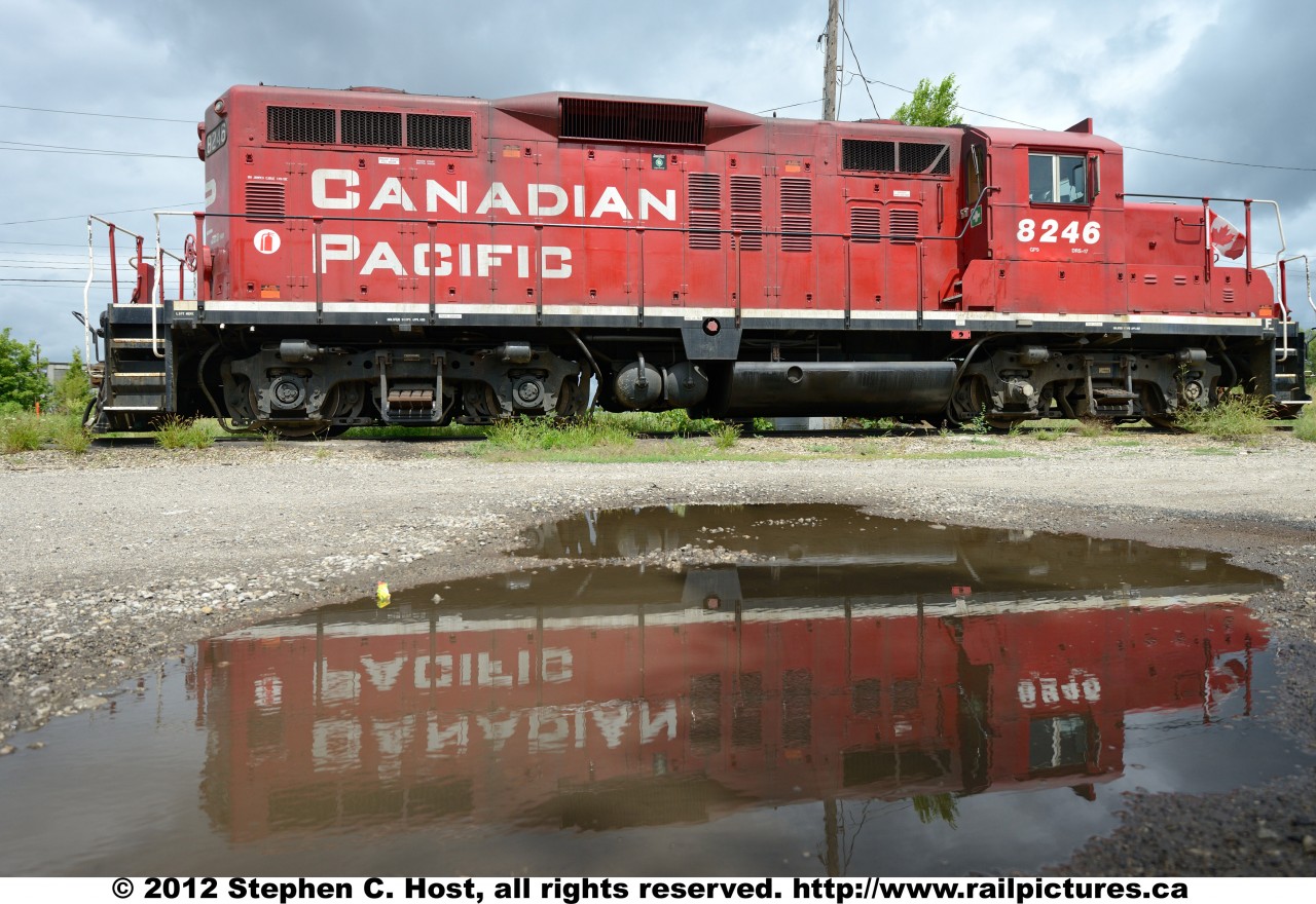 GP9 CP 8246, Rebuilt at Canadian Pacific Angus shops in November 1988 - this lone soldier sits at Galt waiting for the next assignment. Note the Canadian flag a patriotic crew member has affixed to the cab handrails.