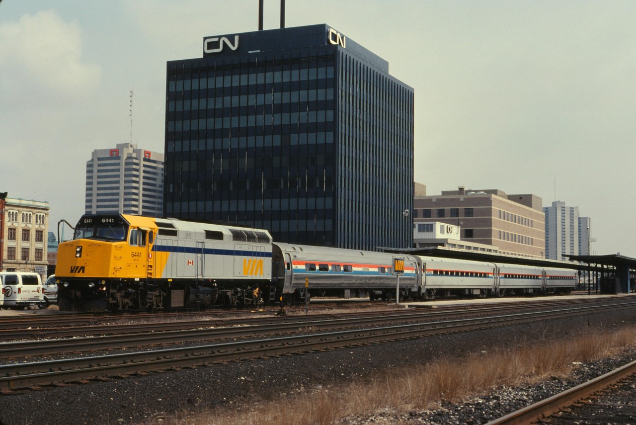 VIA #81 departs London for Sarnia and Chicago with a VIA 6441 leading 4 Amtrak coaches