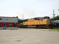 CN 329 departs Coteau after making a set off with UP 4241 and NS 9156, this detour train operated from Buffalo to Montreal due to flooding in the USA.  While foreign power leading west of Toronto was common in 2006, it was less common on the east end.  