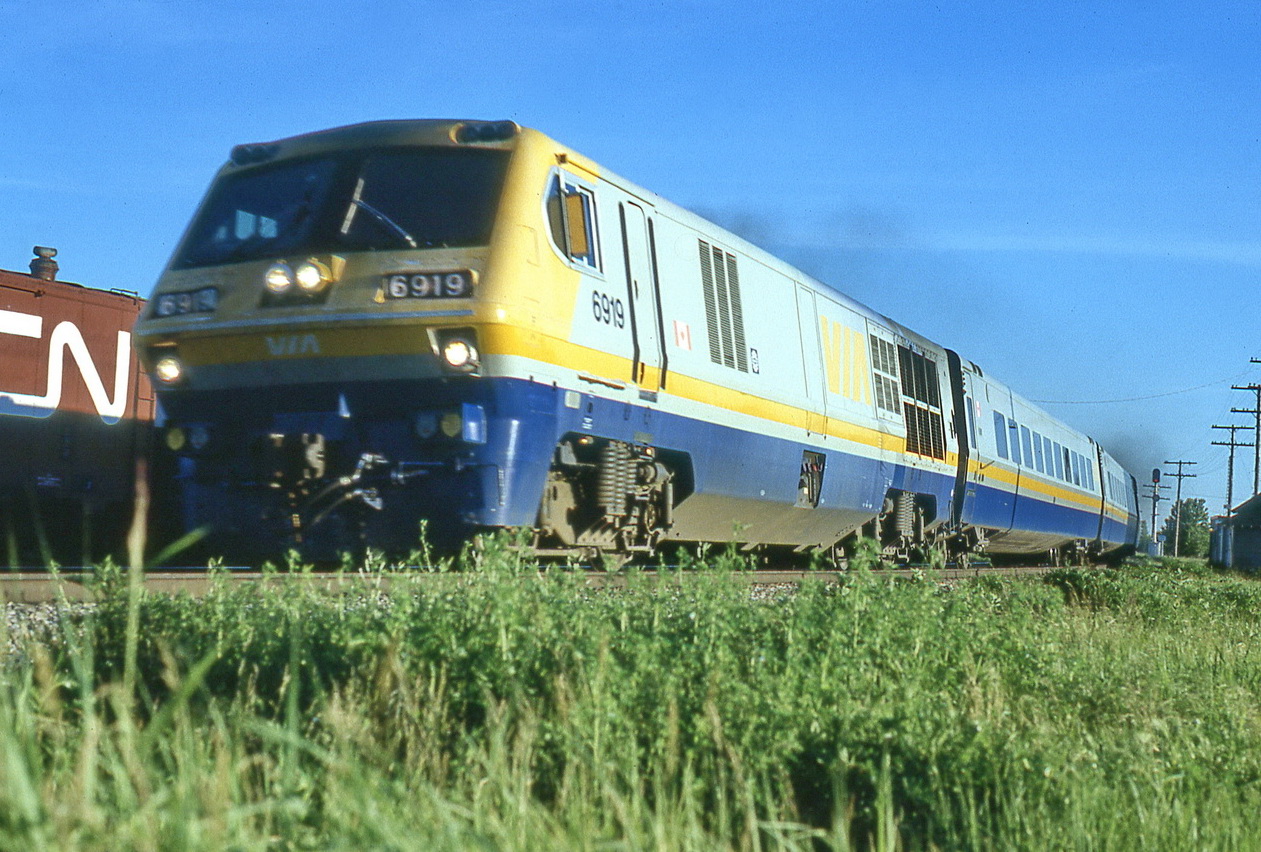 VIA 24 rounds the curve at c 75 mph and opens up the throttle for the 1 mile upgrade.