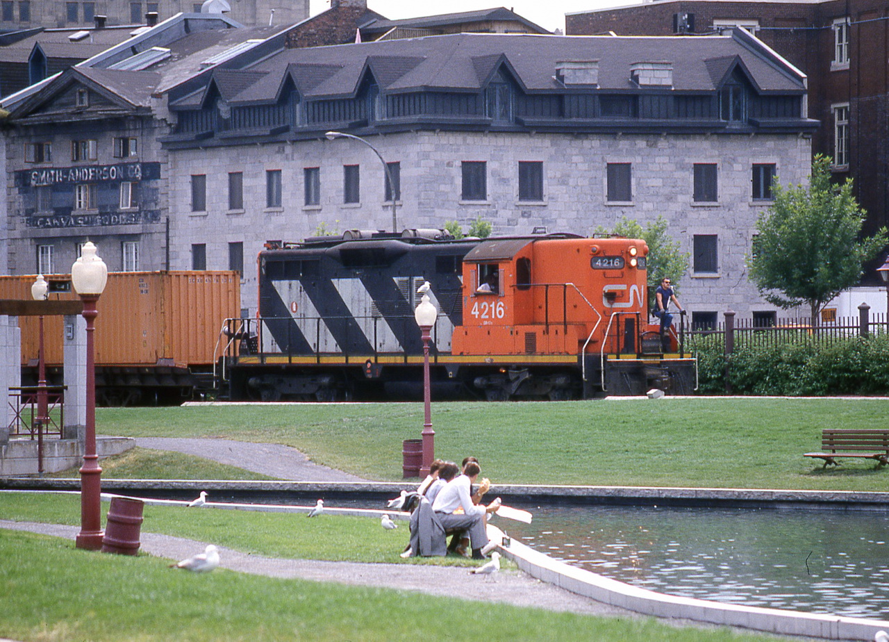 CN 4216 brings containers to the harbor slowly along Commune st.