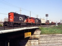 CN 545 with an Sd-40 long hood forward,may be 5373 went to help in the last minute because 7067 was panting for its breath.