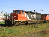 CN 305 waits in the siding with 5340 sporting the latest paint scheme.